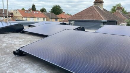 Individual solar PV panels placed separately on a roof in a residential area.